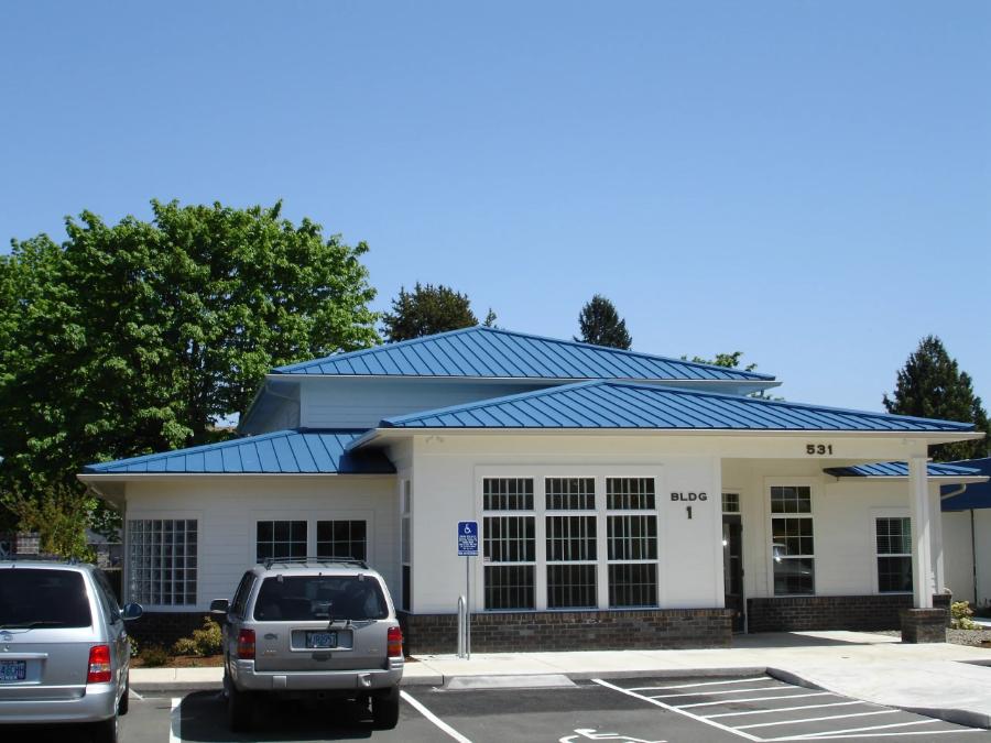 Bruce & Dana Wholesale, Inc. Blue Standing Seam Roof Installed - Image courtesy of https://bruceanddanainc.com/